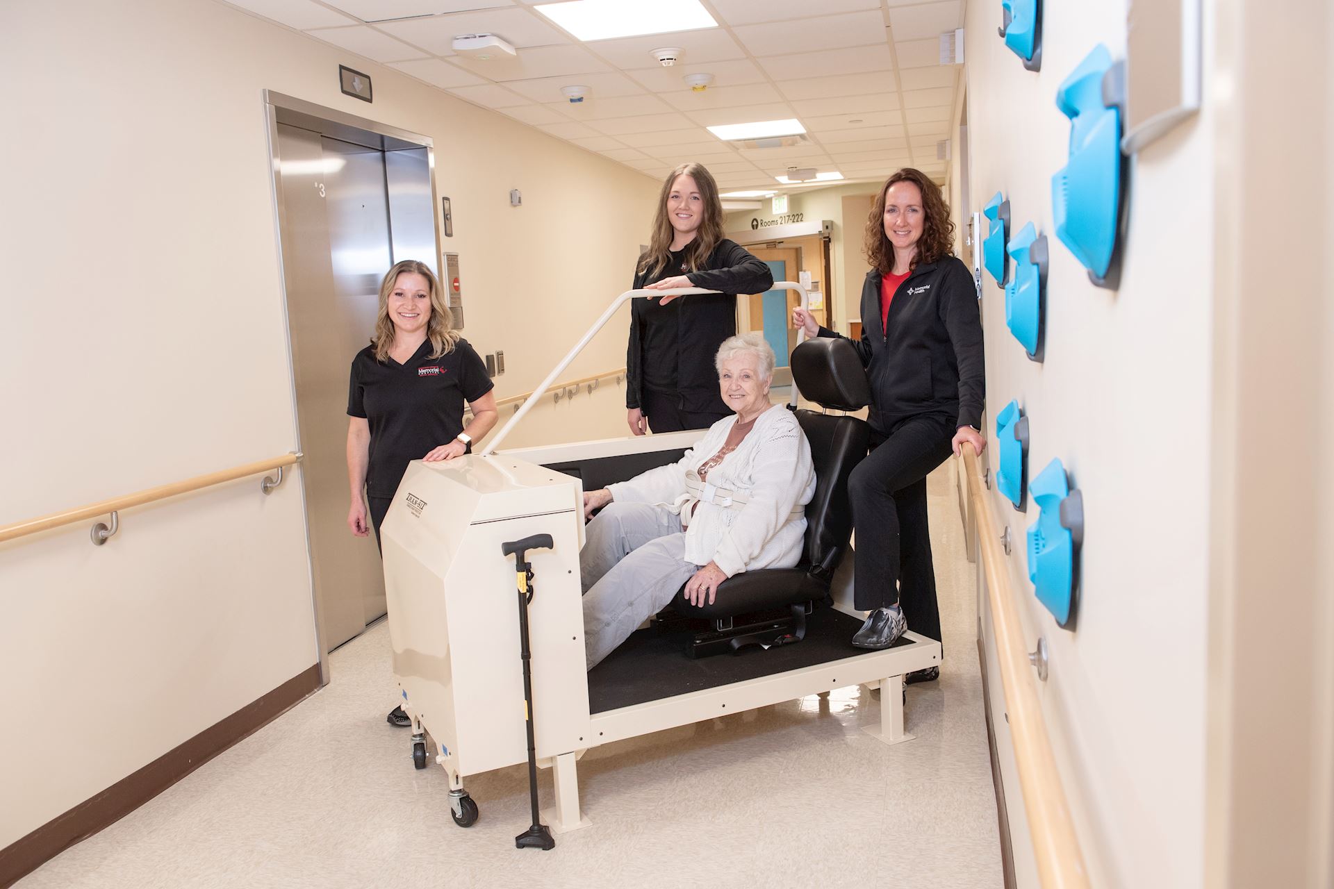 A group of women standing in a hospital hallway