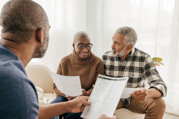 Elderly couple reviewing documents